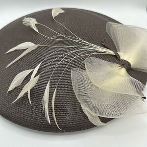 Stunning brown straw hat with cream bow and feather stems
